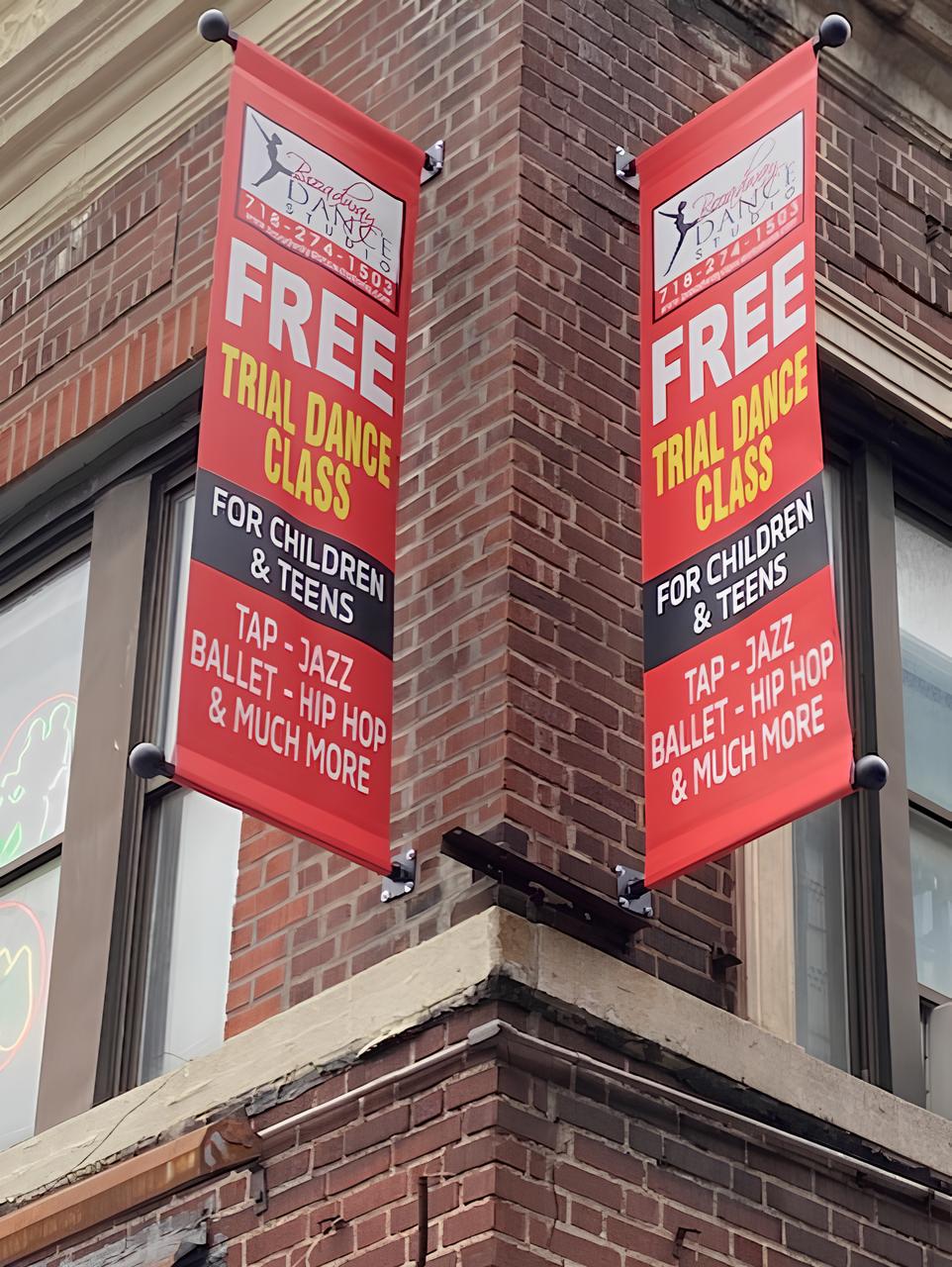 Free trial dance class banners on building.